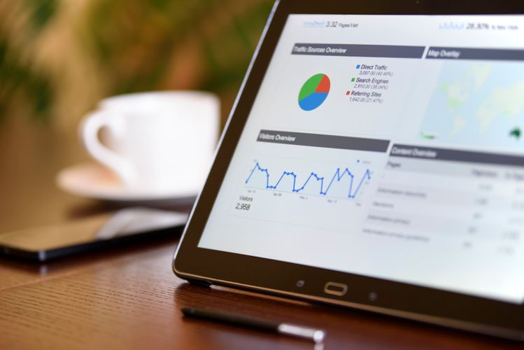 Analytics dashboard on a tablet showing data visualizations and charts