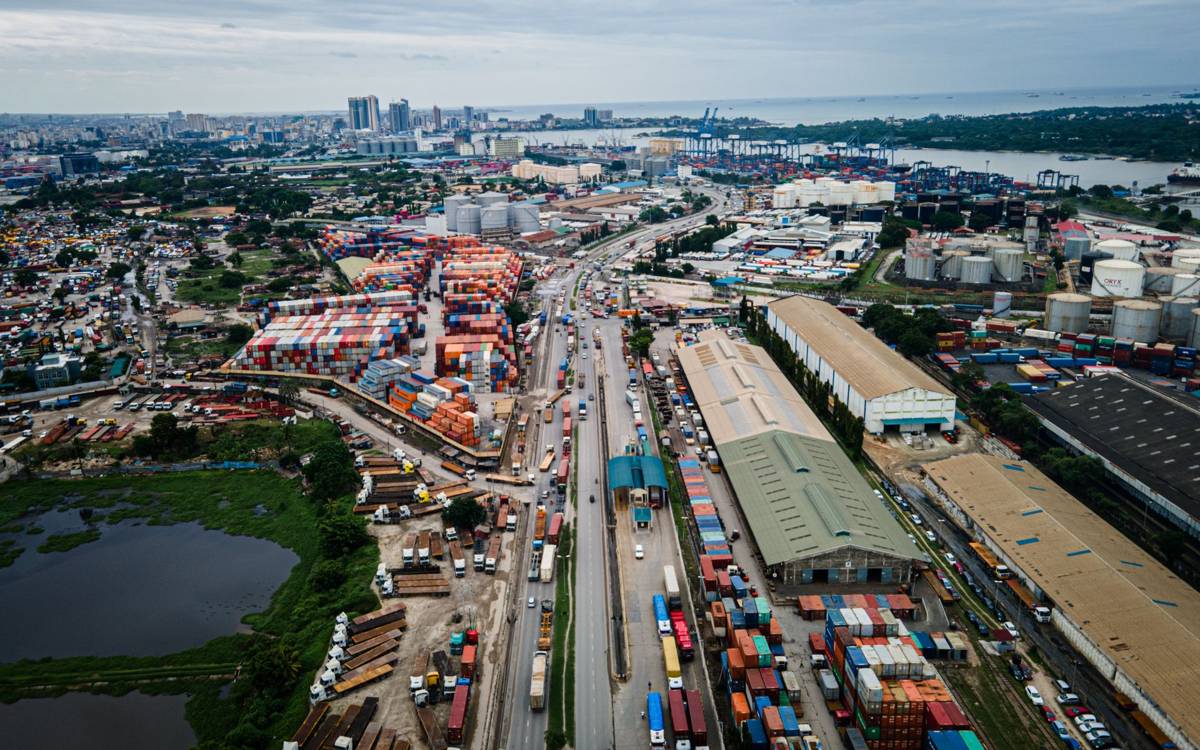 Aerial view of the port of Dar es Salaam with container stacks and inland road corridor